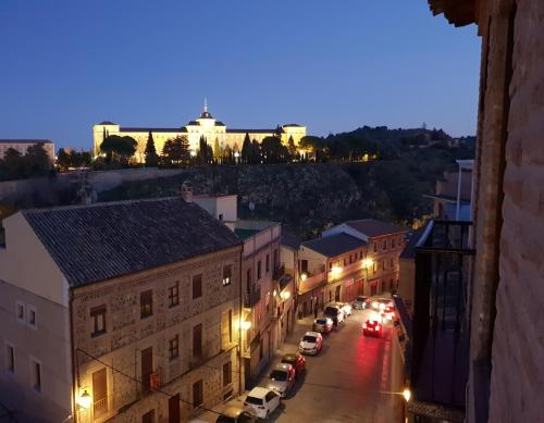 a view of a city street at night at Mirador de Cervantes in Toledo