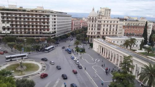a city with a street with cars and buildings at Conte di Cavour in Foggia