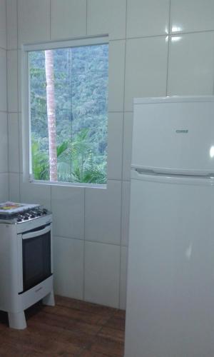 Kuchyň nebo kuchyňský kout v ubytování som das aguas paraty