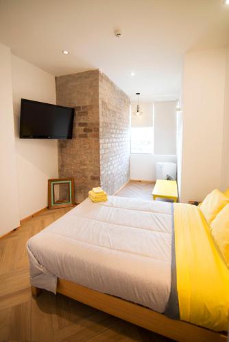 Ένα ή περισσότερα κρεβάτια σε δωμάτιο στο Kauhuhu Casa Hotel