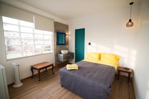 Ένα ή περισσότερα κρεβάτια σε δωμάτιο στο Kauhuhu Casa Hotel
