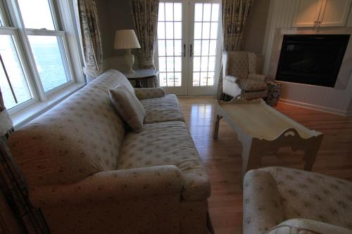 a living room with a couch and a table at Anchor Inn Beach House in Provincetown