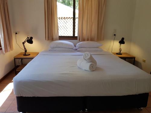 Ліжко або ліжка в номері Byron Bay Rainforest Resort