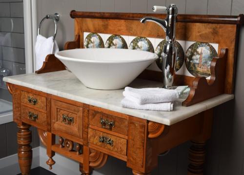a bathroom sink with a white bowl on top of it at Left Bank in Kaikohe