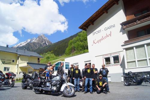 a group of people standing in front of a building with motorcycles at Sport Garni Kapplerhof – Ischgl/Kappl in Kappl