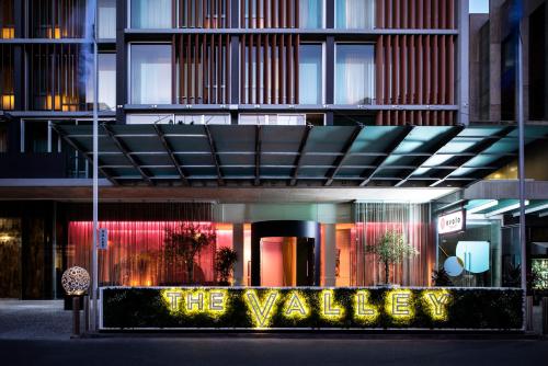 a building with a sign that says thevalley at Ovolo The Valley Brisbane in Brisbane