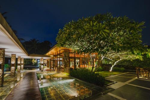 an exterior view of a house at night at The Samaya Ubud in Ubud
