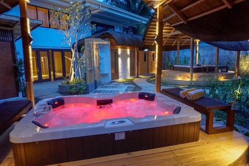 a hot tub in the middle of a patio at Balai Princesa in Puerto Princesa City
