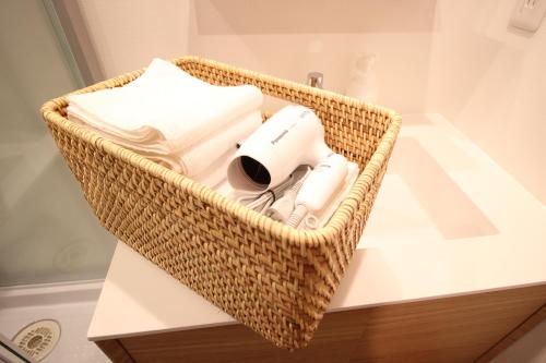 a wicker basket sitting on top of a table at T-home in Tokyo