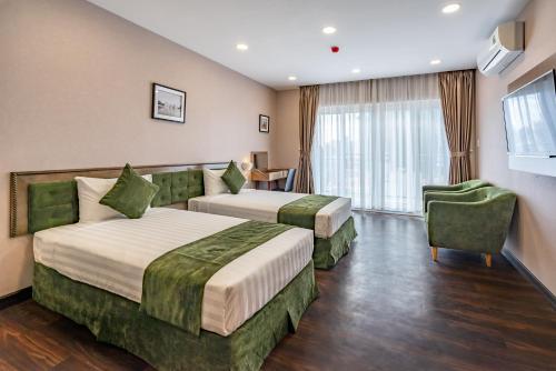 Ein Bett oder Betten in einem Zimmer der Unterkunft Emerald Central