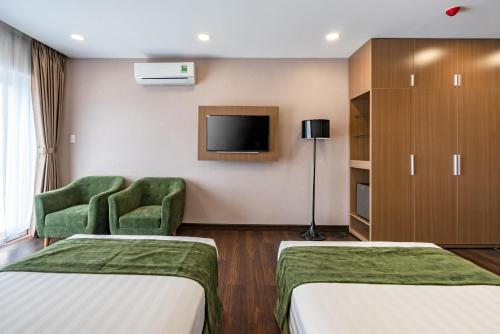 Ein Bett oder Betten in einem Zimmer der Unterkunft Emerald Central