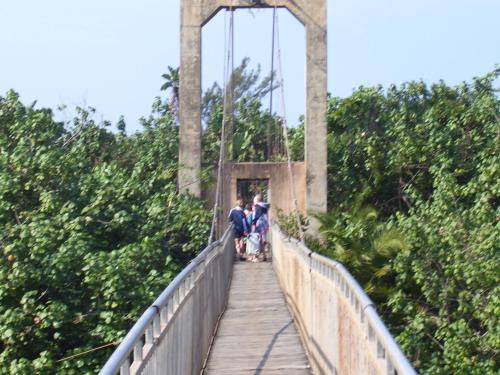 a group of people walking on a bridge at Hibberdene Hideout in Hibberdene