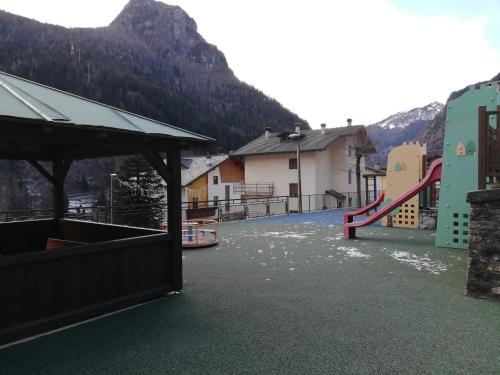 a view of a playground with a slide at Monolocale Energy in Carona