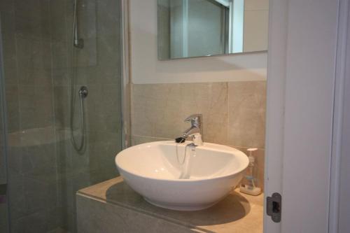 a bathroom with a white sink and a shower at Casa Nimajas in Vera