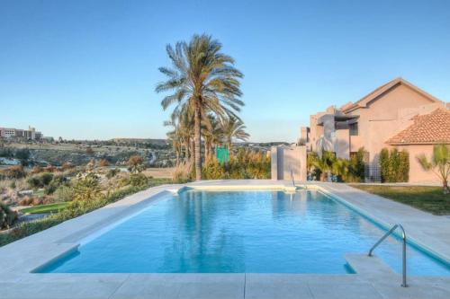 a swimming pool in front of a house at Casa Nimajas in Vera