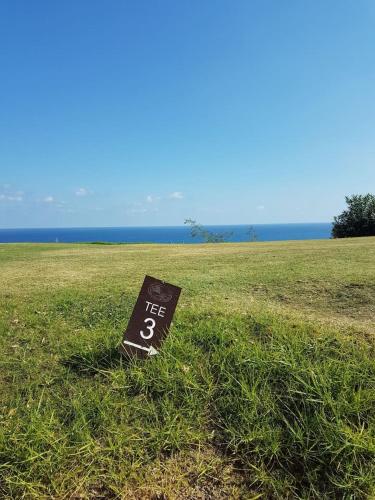 a sign sitting in the grass in a field at Casa Nimajas in Vera