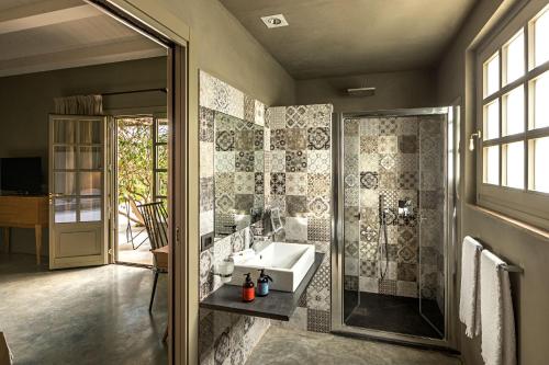 a bathroom with a sink and a shower at Country House Villadorata in Noto