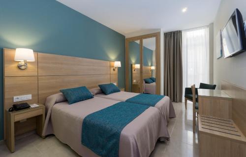 Krevet ili kreveti u jedinici u okviru objekta Hotel Sur Málaga
