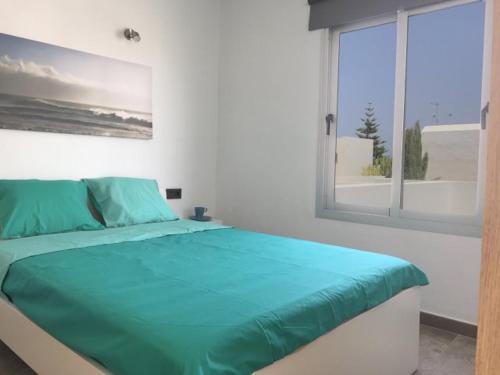 Llit o llits en una habitació de Sunny Studio Lanzarote