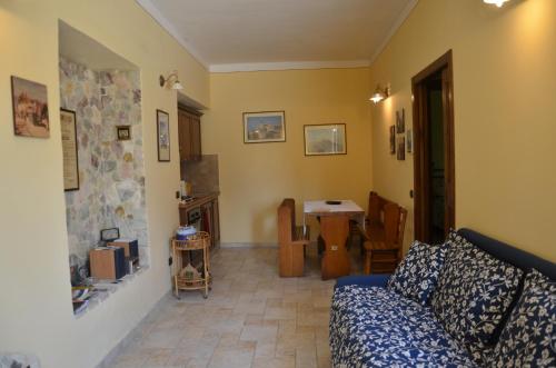 a living room with a couch and a table at B&B La Terrazza Del Subasio in Assisi