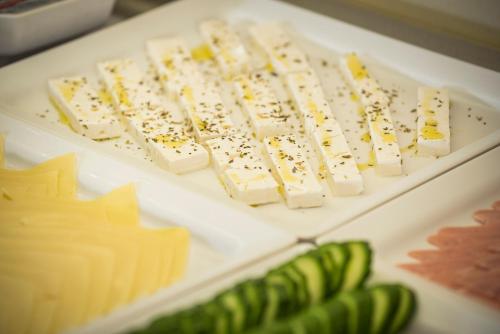 a bunch of cheese and other foods on a table at Elotis Suites in Agia Marina Nea Kydonias