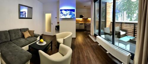 Ruang duduk di Útulný apartmán u Mumlavských vodopádů