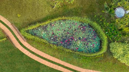 an overhead view of a garden with a circle of flowers at Niraamaya Wellness Retreats Backwaters And Beyond Kumarakom in Kumarakom