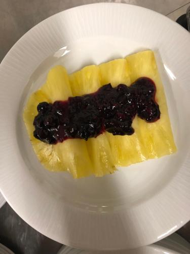 a piece of fruit on a white plate at Boutique Hotel Palazzo Corso Umberto in Boiano