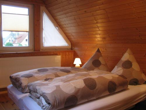 Кровать или кровати в номере Ferienhaus Troge