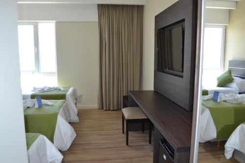 Postel nebo postele na pokoji v ubytování Hotel Oscar Lescano - All Inclusive