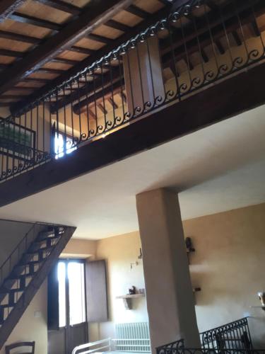 a staircase in a building with a stair railing at La Villa degli Ulivi in Fermo