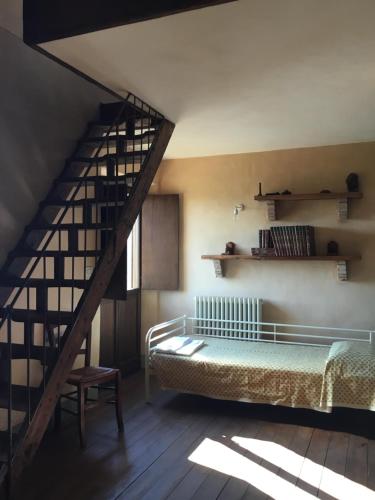 Postelja oz. postelje v sobi nastanitve La Villa degli Ulivi