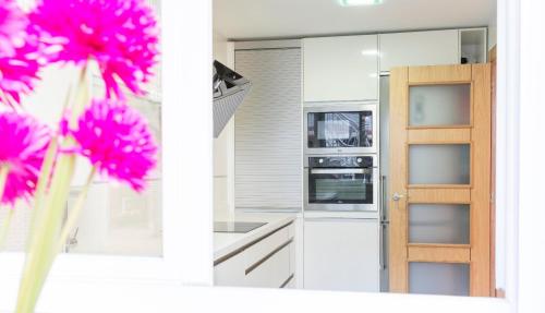 Kuchyň nebo kuchyňský kout v ubytování Apartamento Ria de Boo, Con patio privado