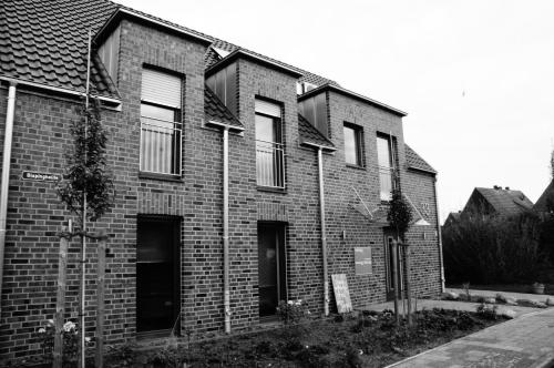 a black and white photo of a brick building at Bisping33 in Ascheberg