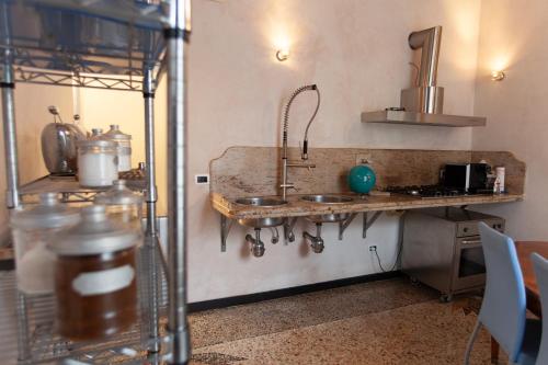 a kitchen with a sink and a counter at Due Papi in Savona