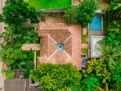 an overhead view of a building with a clock on it at Thambu Illam in Jaffna