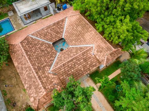 an overhead view of a brick walkway with a swimming pool at Thambu Illam in Jaffna