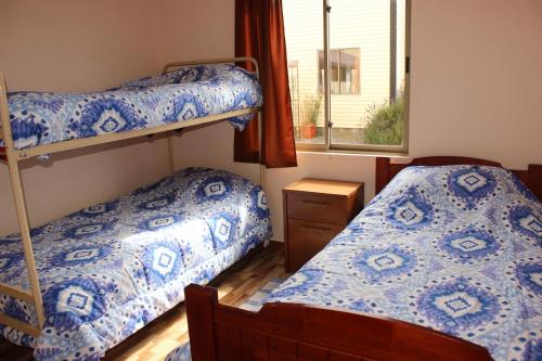 En eller flere senger på et rom på Cabanas Via Nautica