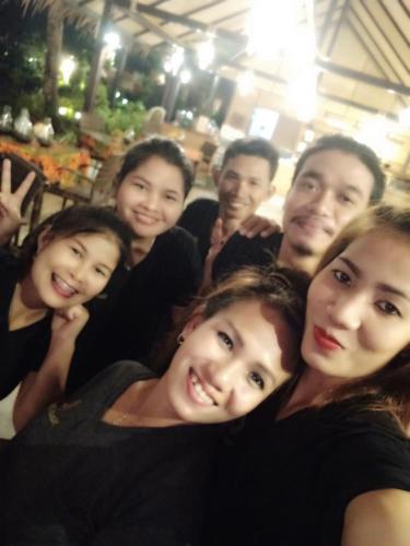 a group of people posing for a picture at Nautilus Right on the Beach - Adult Only - SHA Extra Plus in Ko Lanta