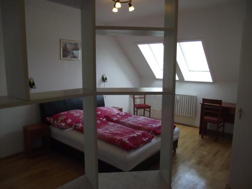 a bedroom with a bunk bed with a window at Apartman Kaszás City in Mosonmagyaróvár