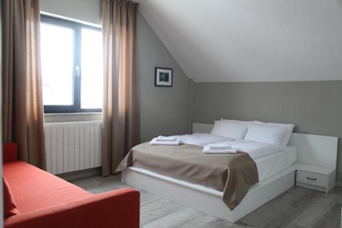 Кровать или кровати в номере Double House Bakuriani