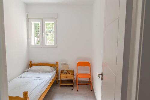 Llit o llits en una habitació de Apartamento cerca de la Playa y el Centro