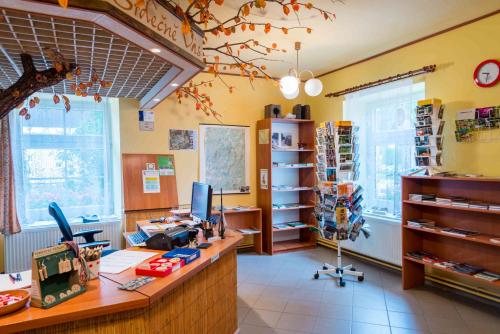 an office with a desk with a computer on it at Penzion U Michala in Prášily