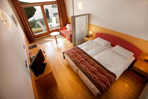 Ένα ή περισσότερα κρεβάτια σε δωμάτιο στο Hotel Baia Verde