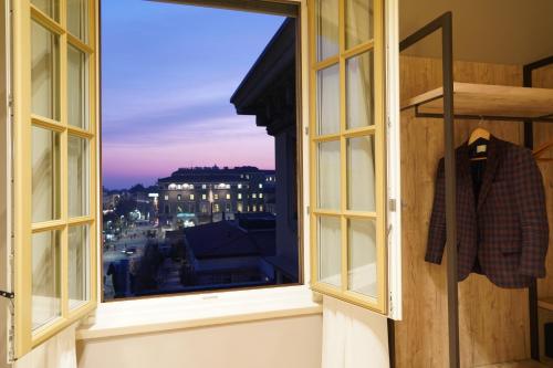 a window with a view of a city at Bergamo Inn 43 in Bergamo