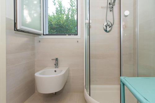 a bathroom with a sink and a shower at Gli Ulivi Rosamarina Ostuni in Rosa Marina