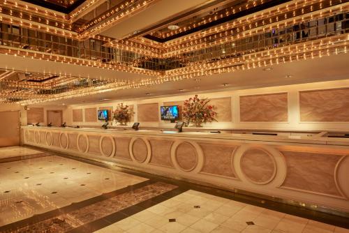 a lobby with a long counter in a building at Four Queens Hotel and Casino in Las Vegas