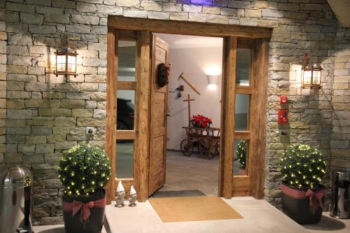 an open door into a room with christmas lights at Hotelino Petit Chalet in Celerina