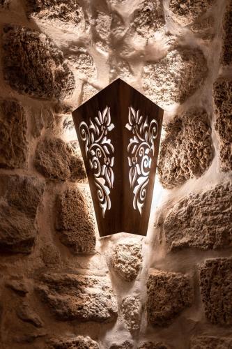 a wall with a plaque on a stone wall at Zidan Sarai in ‘Akko