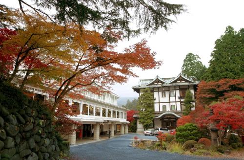 a street in a town with trees and buildings at Nikko Kanaya Hotel in Nikko